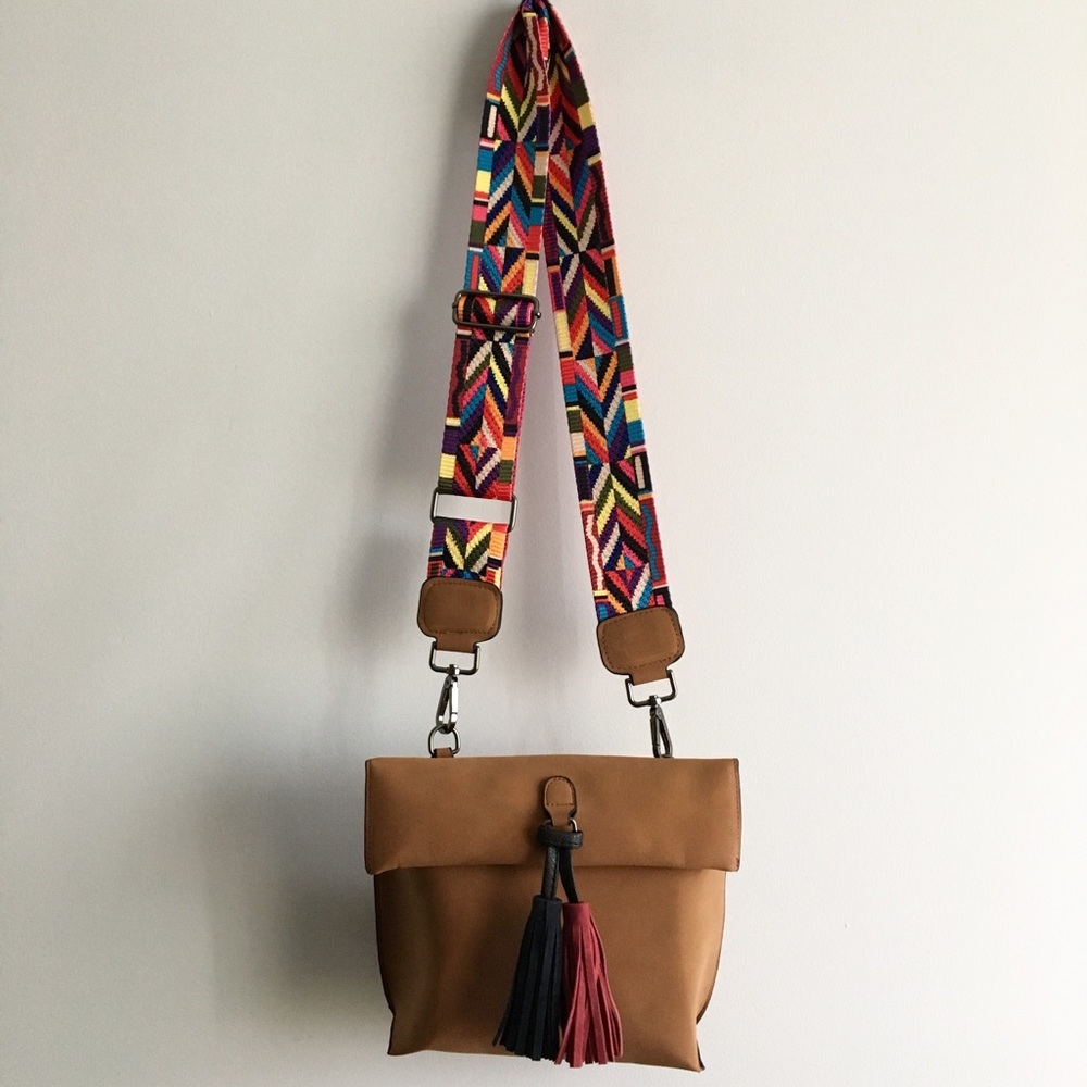 Purse with eclectic, interchangeable strap.
